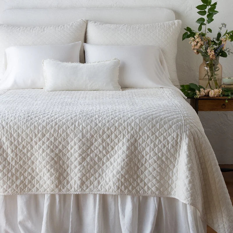 Queen-sized Bella Notte quilted silk velvet coverlet in winter white with a plush, quilted texture for luxurious bedding.