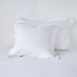 White linen standard sham by Bella Notte, featuring soft, textured fabric and elegant design, ideal for a cozy bedroom decor.