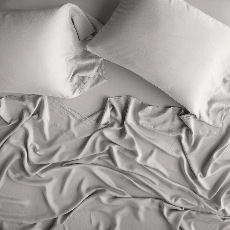 King size Bella Notte Madera Luxe Pillowcase in Moonlight fabric, showcasing soft, luxurious bedding with detailed stitching.