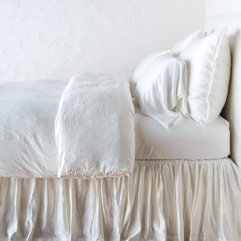 In Stock Bella Notte Paloma duvet cover in Winter White for king-sized bed, showcasing soft textured fabric and elegant design.
