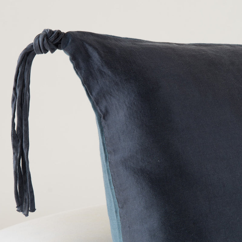 In Stock Bella Notte Taline Sham Midnight Euro with elegant dark blue fabric and decorative stitching for a luxurious bedroom look.