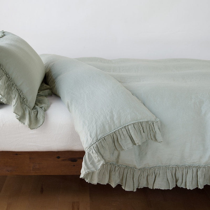 King linen duvet cover in eucalyptus color from Bella Notte’s Linen Whisper collection, soft and elegant bedding for a cozy bedroom.