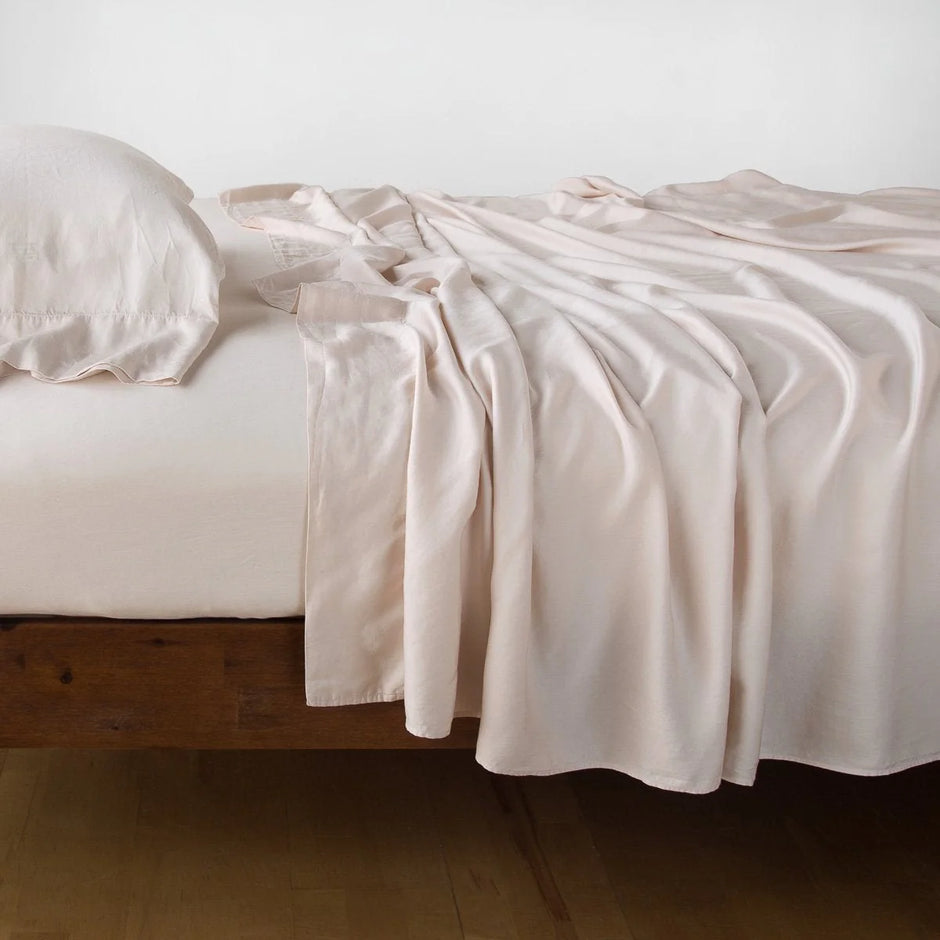 Pearl-colored Madera Luxe fitted sheet for Eastern King bed by Bella Notte, showcasing smooth, luxurious fabric and tailored fit.