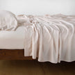 Pearl-colored Madera Luxe fitted sheet for Eastern King bed by Bella Notte, showcasing smooth, luxurious fabric and tailored fit.