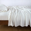 In Stock Bella Notte Madera Luxe Flat Sheet in Winter White, queen size, showcasing soft, luxurious bedding fabric.