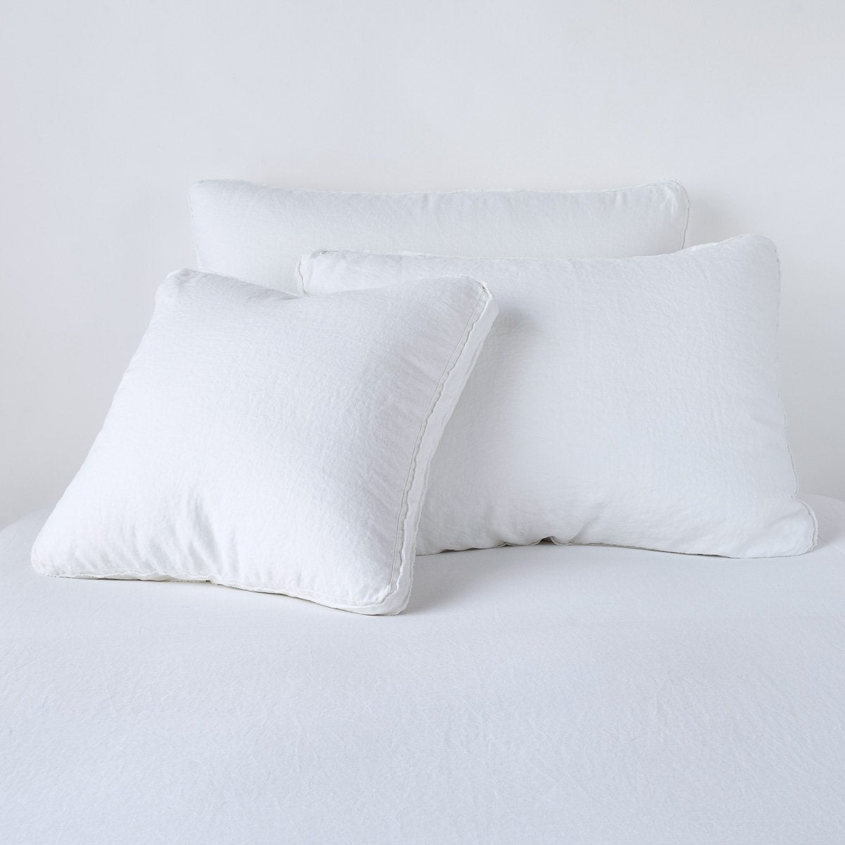 White Austin Sham Deluxe by Bella Notte, plush fabric with elegant stitching, designed for a luxurious bedroom look.