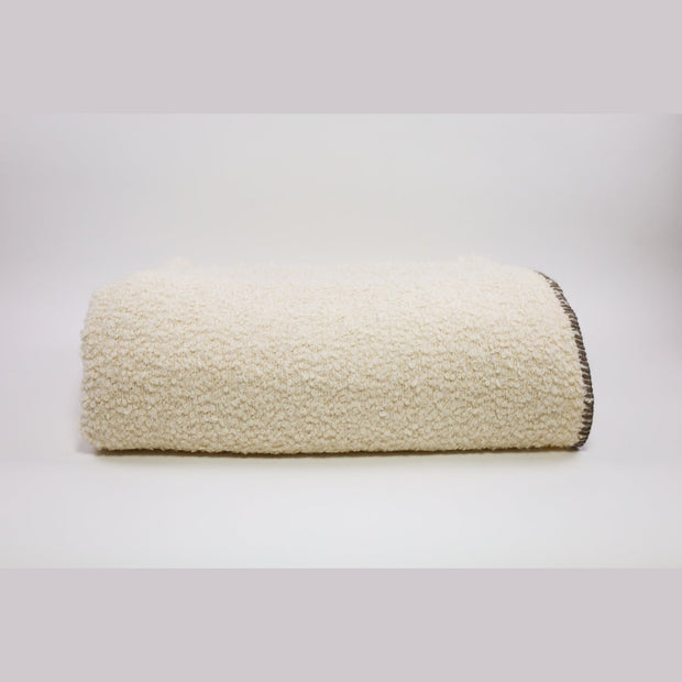Cream Uniq'uity Kahlo throw blanket, 59x78 inches, featuring vibrant, artistic design perfect for cozy home decor.