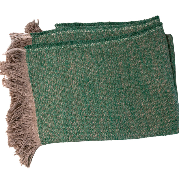 Moss green Uniq'uity Nash throw blanket spread out, soft textured fabric, cozy home decor from In Stock Uniq'uity.