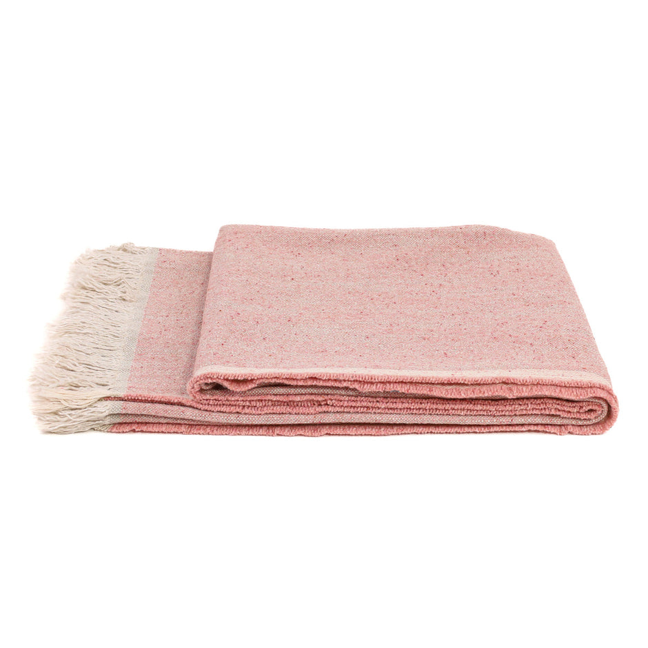 Pink Uniq'uity Judd Throw blanket displayed folded, showcasing soft fabric and stylish design for cozy home decor.
