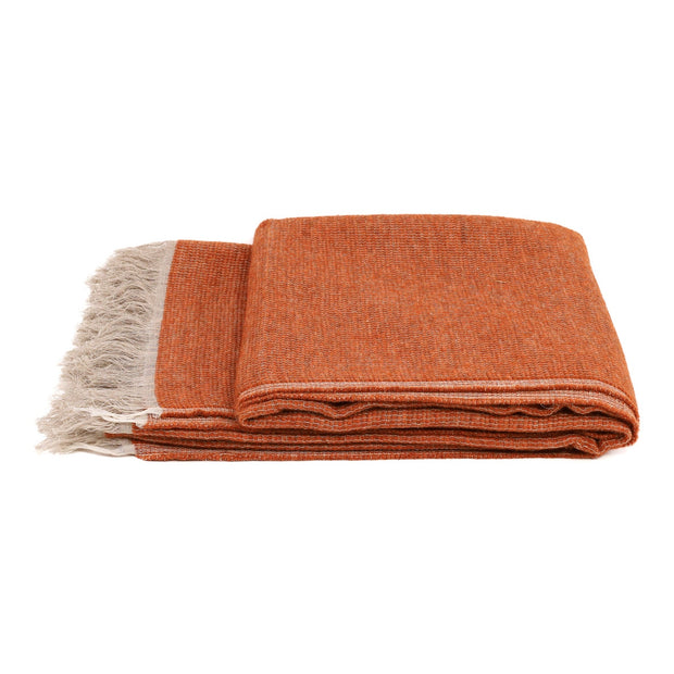 White Uniq'uity Allen throw blanket, soft and cozy fabric, displayed folded with textured surface and subtle stitching details.
