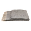 White Uniq'uity Allen throw blanket featuring soft, cozy fabric and stylish design, perfect for adding comfort to your space.