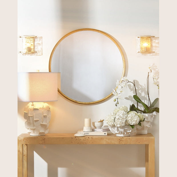 Refined round gold leaf mirror by Jamie Young Company, showcasing a sleek, elegant design with a gold leaf finish.