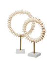 Two decorative circular sculptures made of stacked natural wood discs on slender brass stands with square white marble bases, photographed against a clean white background.