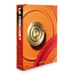 Le Creuset decor book with a gold handle on an orange background