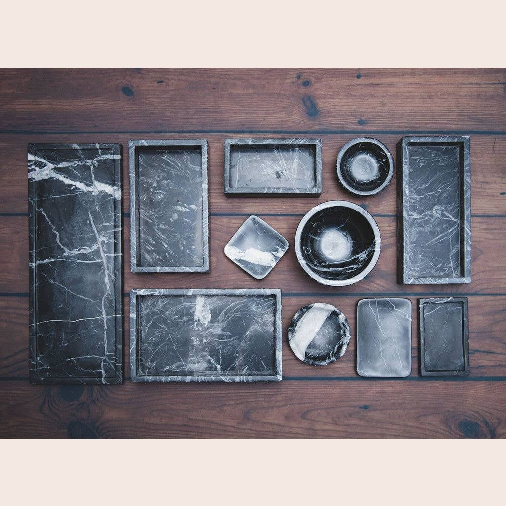 Rounded black marble soap dish from Lothantique Inc., featuring smooth polished surface and elegant bath accessory design.