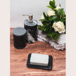 Black marble soap dish from Lothantique Inc., rounded bath accessory with smooth, polished surface for bathroom decor.