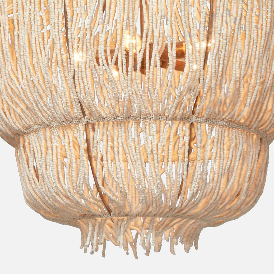 Made Goods Aida Chandelier with elegant glass globes and brass accents hanging from a sleek metal frame.