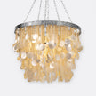 Made Goods Henry Chandelier with multiple glass globes and metal frame, hanging from the ceiling in a modern decor setting.