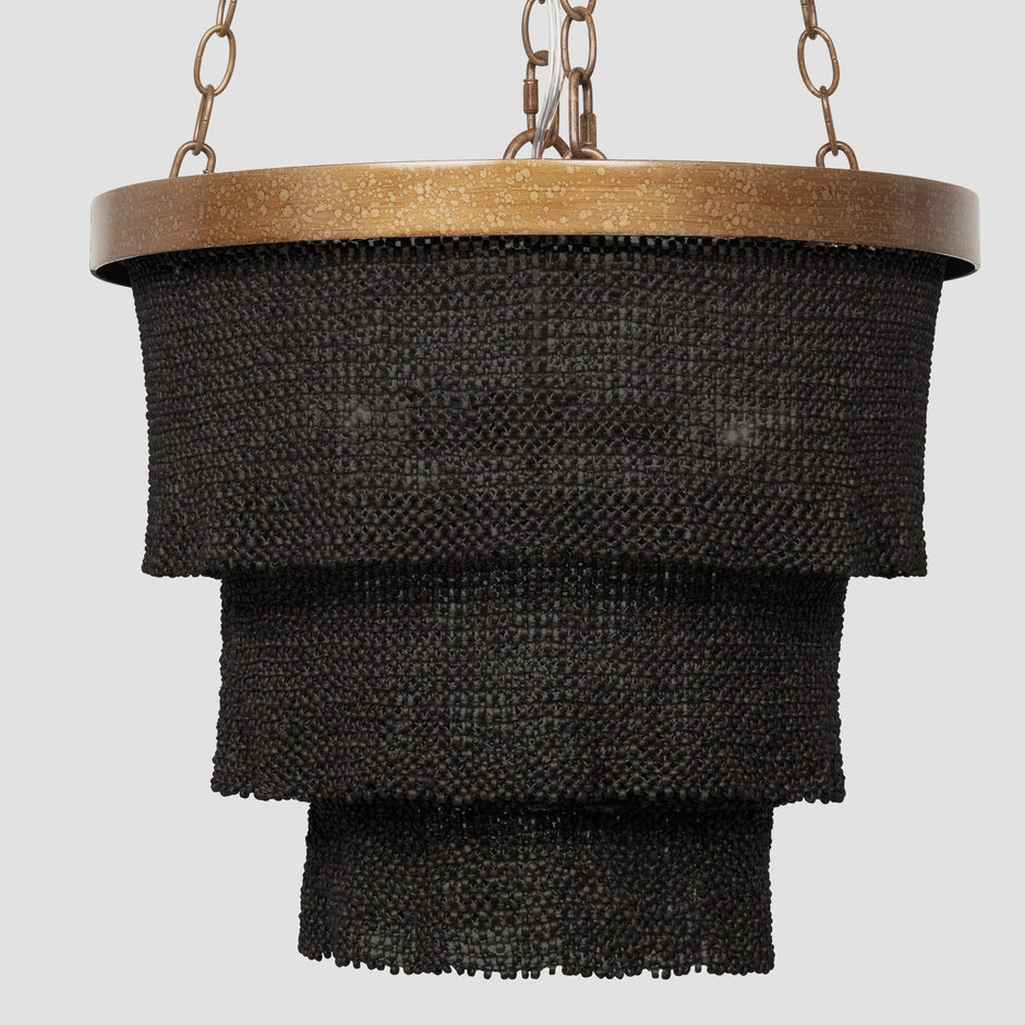 Made Goods Patricia round chandelier with multiple glass globes and brass accents hanging from a circular frame.