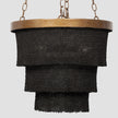 Made Goods Patricia round chandelier with multiple glass globes and brass accents hanging from a circular frame.