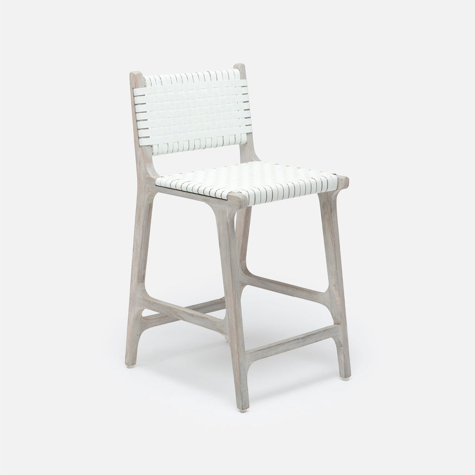 Made Goods Rawley counter stool with aged natural teak frame and black faux rattan seating, ideal as a stylish dining chair.