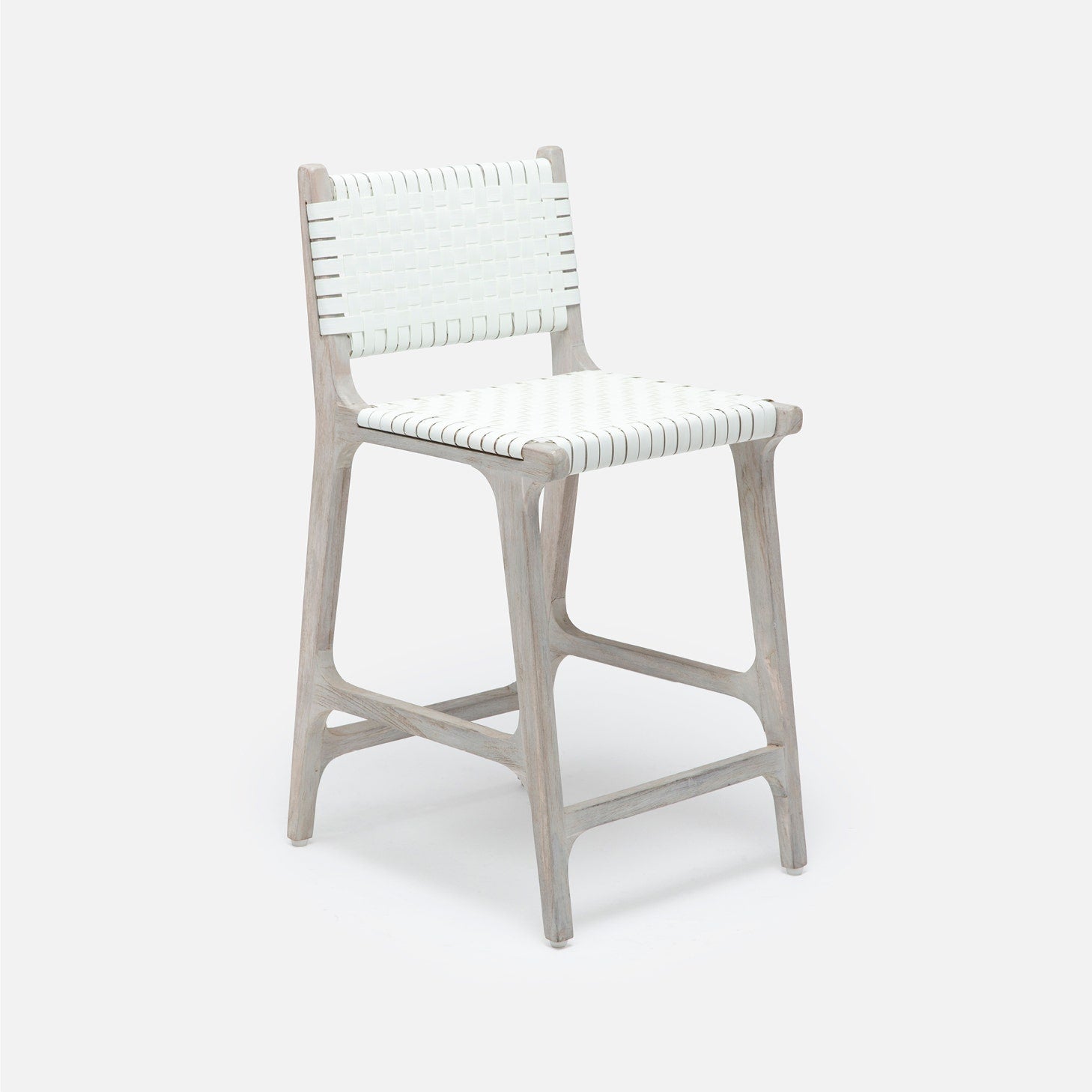 Made Goods Rawley counter stool with aged natural teak frame and black faux rattan seating, ideal as a stylish dining chair.