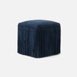 Made Goods Hallie Stool with plush fur upholstery and wooden legs, showcasing a stylish and comfortable seating option.
