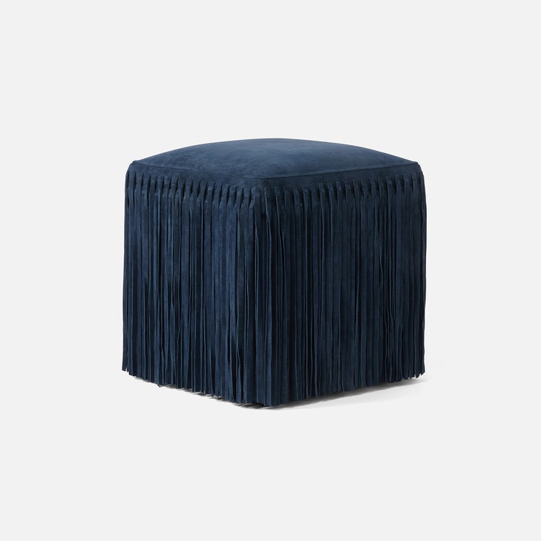 Made Goods Hallie Stool with plush fur upholstery and wooden legs, showcasing a stylish and comfortable seating option.