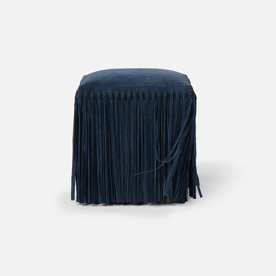Made Goods Hallie stool with plush fur upholstery and wooden legs, showcasing a stylish and comfortable seating option.