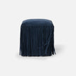 Made Goods Hallie stool with plush fur upholstery and wooden legs, showcasing a stylish and comfortable seating option.
