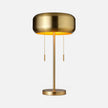 Made Goods Makoa task table lamp with a sleek design, featuring a modern metal base and adjustable arm.
