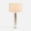 Made Goods Tavis Table Lamp with warm silver finish, featuring a sleek modern design and a cylindrical lampshade.