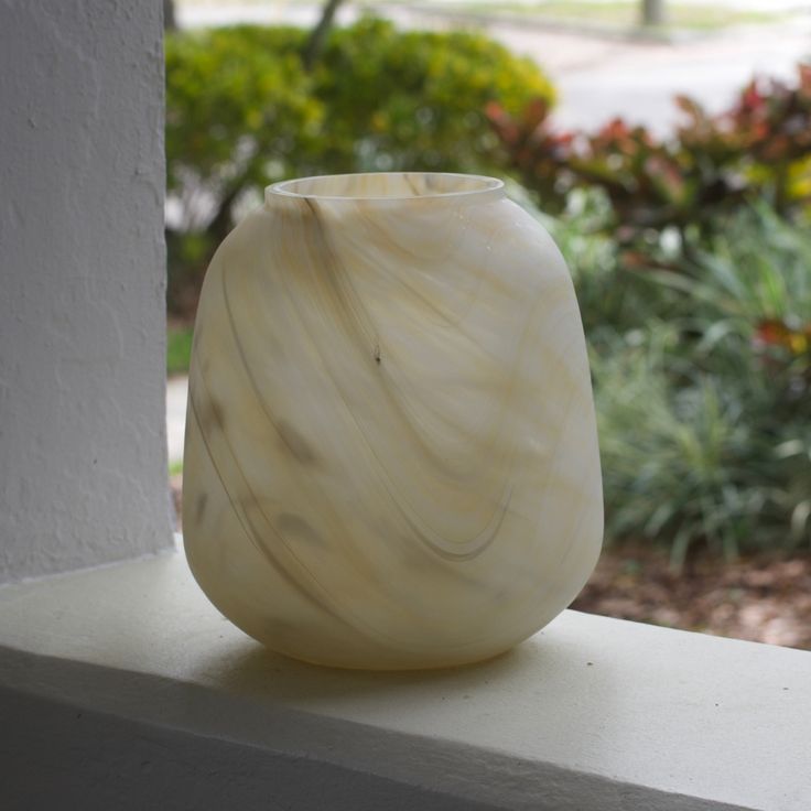 Made Goods Andra Alabaster Vase with smooth, rounded design and natural alabaster finish on a neutral surface.