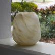 Made Goods Andra Alabaster Vase with smooth, rounded design and natural alabaster finish on a neutral surface.