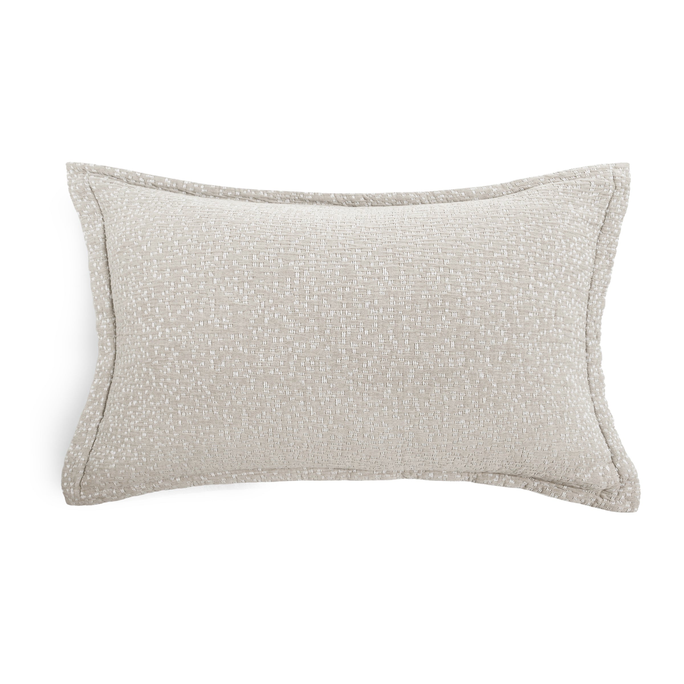 A rectangular lumbar throw pillow in a textured light beige fabric with piped edges, shown on a plain white background.