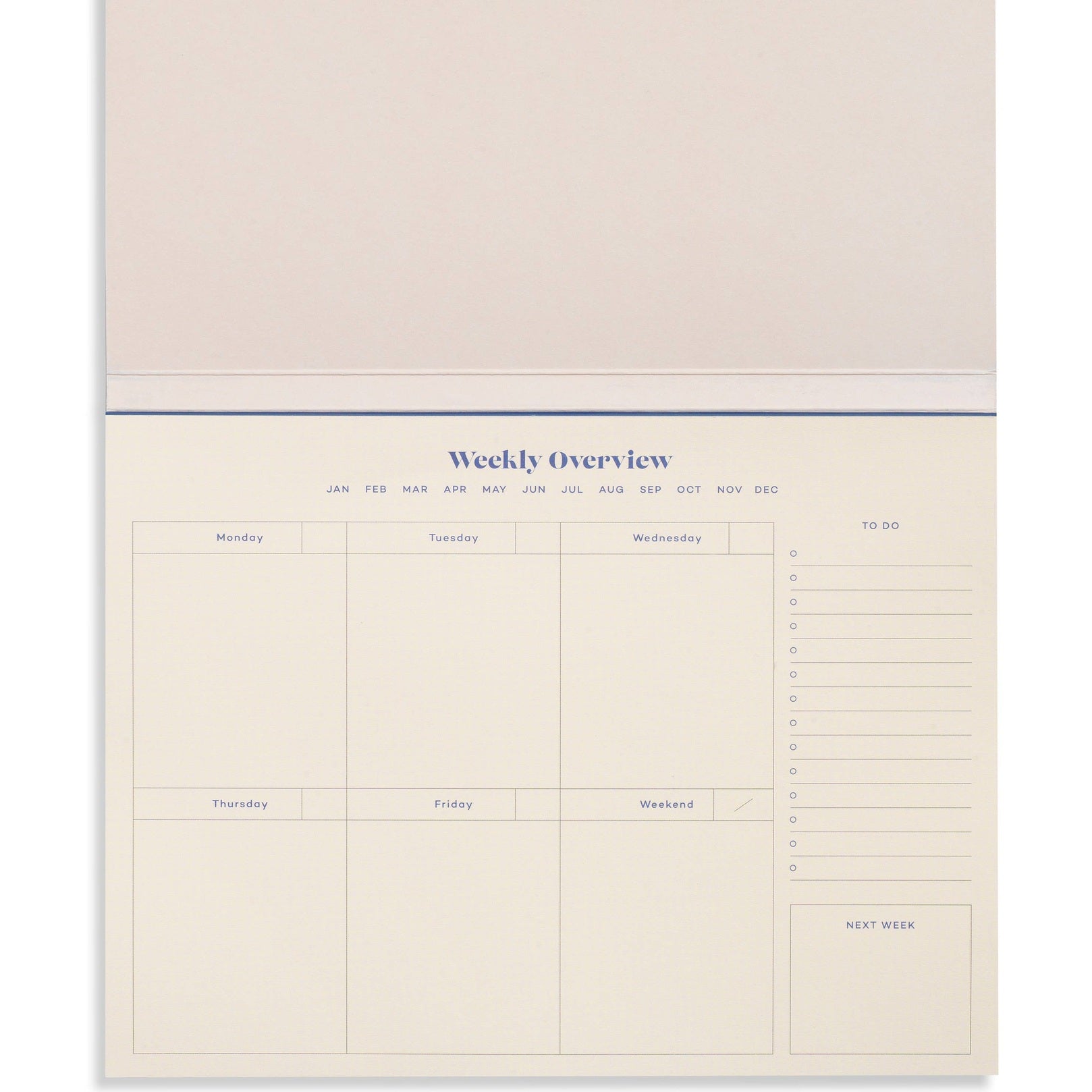 Blue Joy Undated Weekly Desk Planner by Papier with open pages showing daily and weekly scheduling sections.