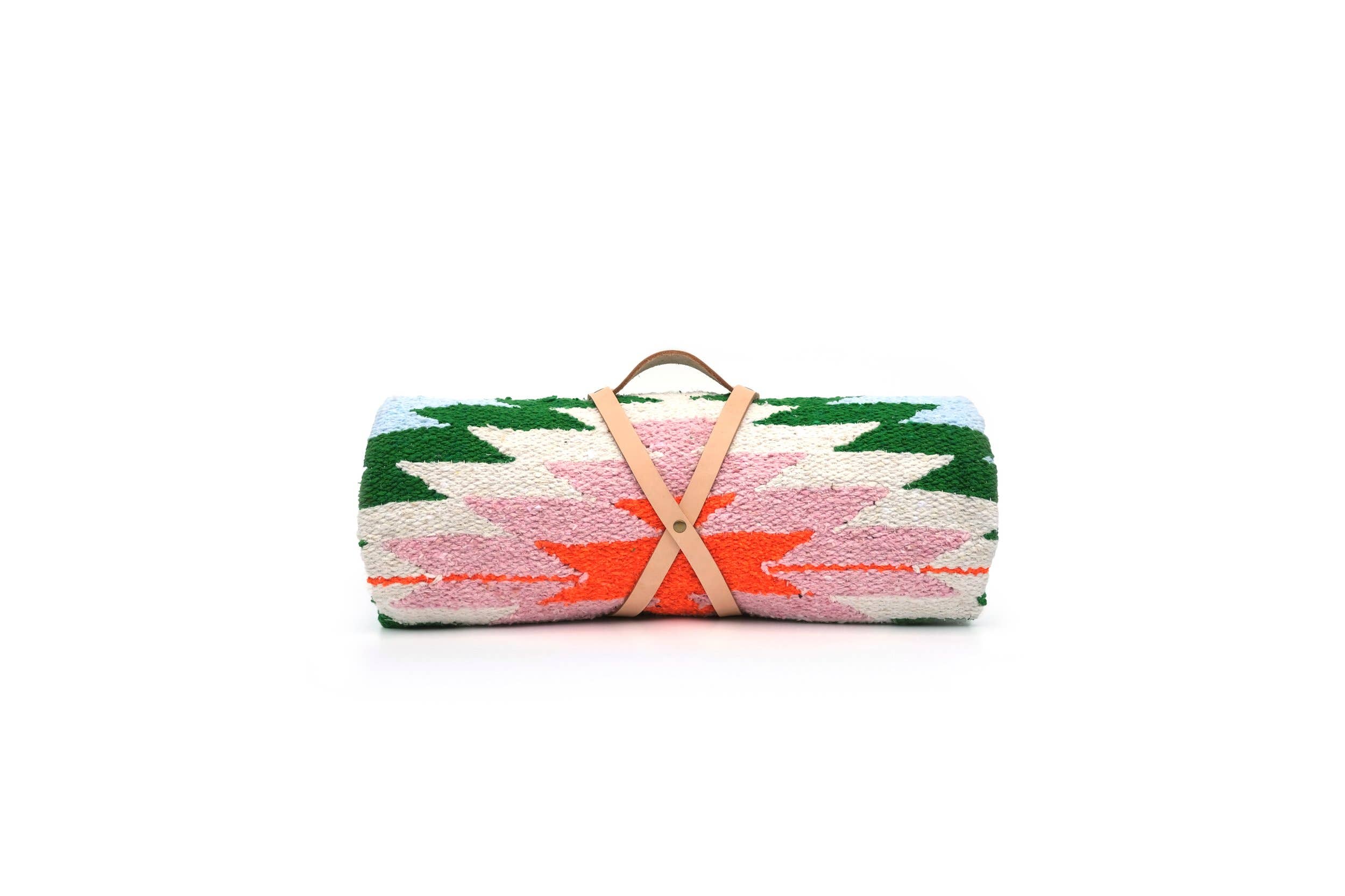 Colorful woven blanket with a handle on a white background