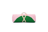 Pink and green clutch bag with a beige strap on a white background