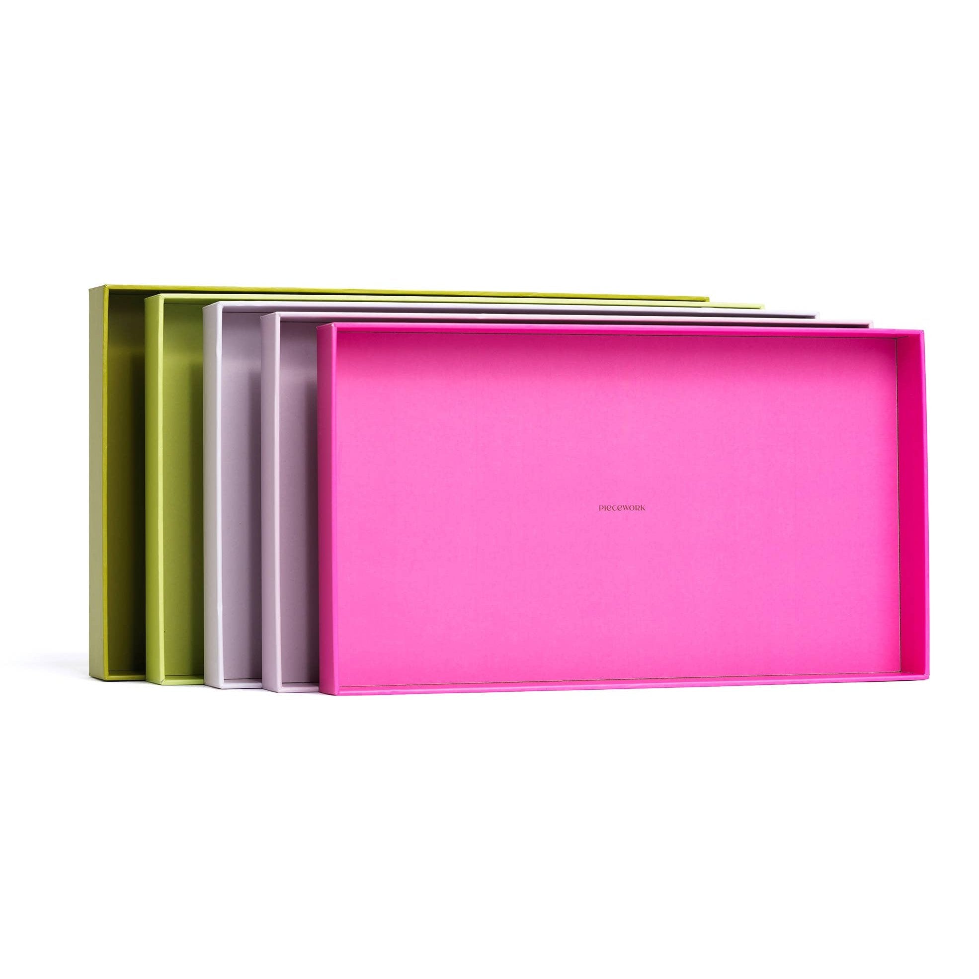 Piecework Puzzle Trays for organizing and sorting jigsaw puzzles, with multiple compartments for easy puzzle assembly.