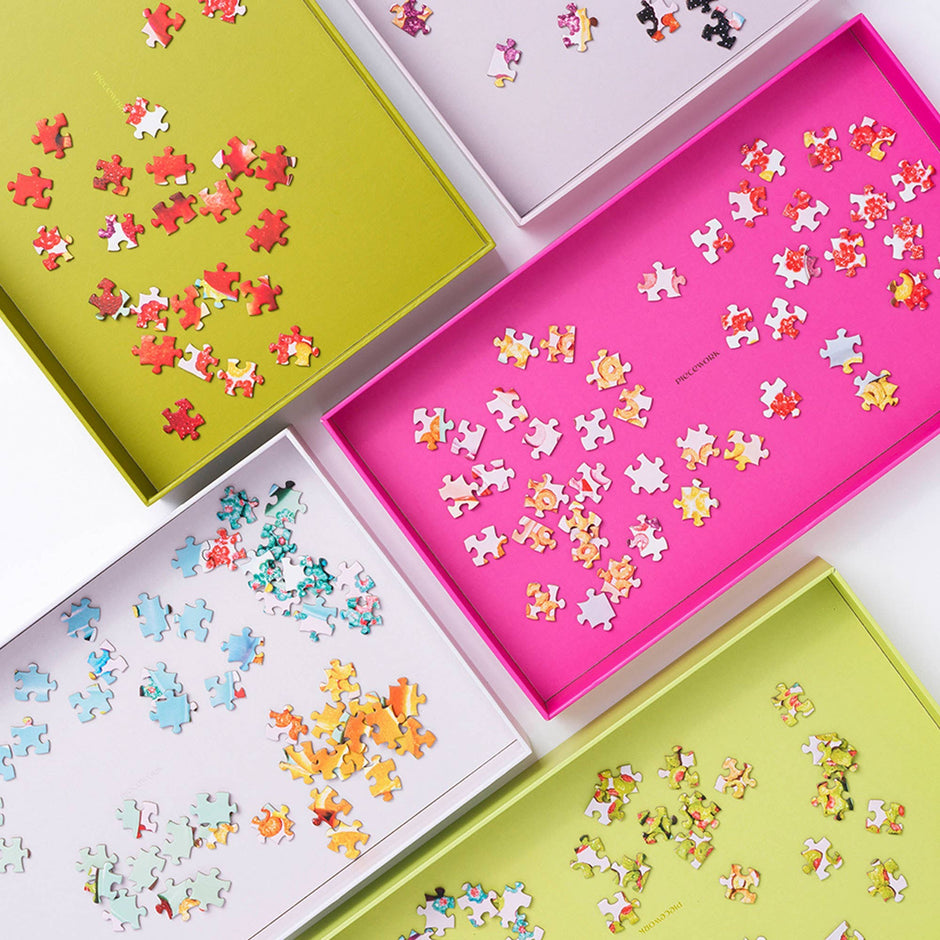 Piecework Puzzle Trays for organizing and sorting jigsaw puzzles, featuring multiple compartments and durable plastic construction.