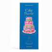 Piecework Specialty Puzzle Cake 1000-piece jigsaw puzzle showing a colorful, detailed cake design on a flat surface.