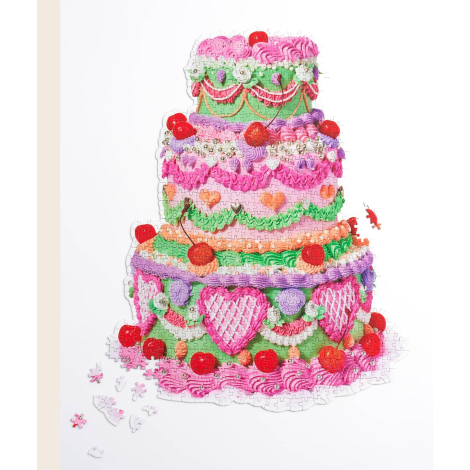 Piecework Specialty Puzzle Cake 1000-piece puzzle featuring colorful cake imagery, ideal for puzzle enthusiasts and collectors.