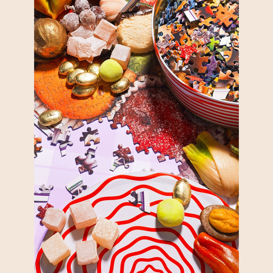 Specialty Puzzle Sugarplum Cookie Tin by Piecework with festive holiday design and colorful sugarplum cookies inside.