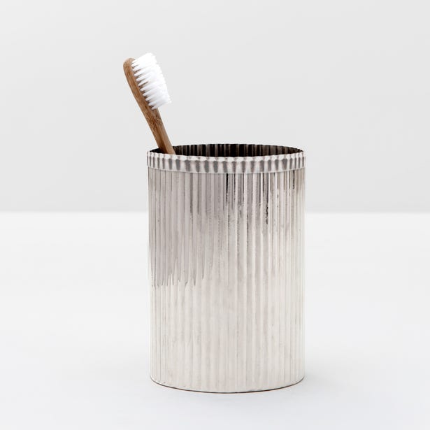 Shiny nickel Pigeon & Poodle Redon toothbrush holder in a modern bathroom setting with two toothbrush slots.