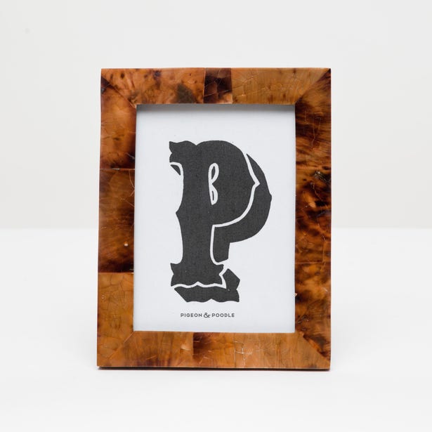 Pigeon & Poodle Basel frame holding a 4x6 photo with a modern, minimalist design in neutral tones.