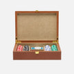 Pigeon & Poodle Grantham leather poker set in beige and aged camel leather, includes poker chips and cards on a game table.