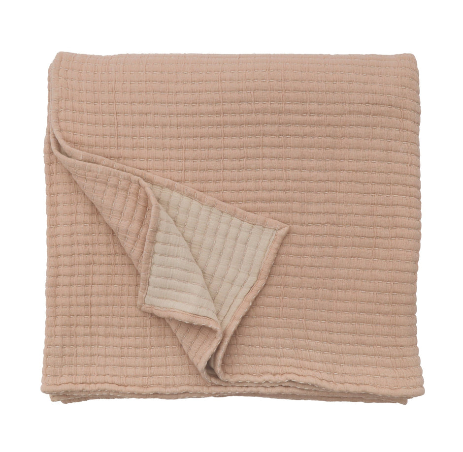 Amber Pom Pom at Home Vancouver Coverlet blanket with soft, woven texture and decorative pom pom accents in a cozy bedroom setting.