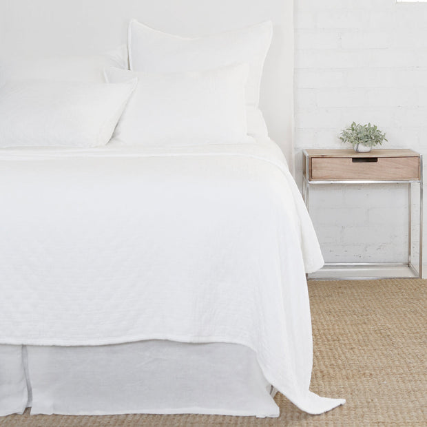White Pom Pom at Home Ojai Matelasse Coverlet, a soft decorative blanket with textured quilting for cozy bedroom decor.