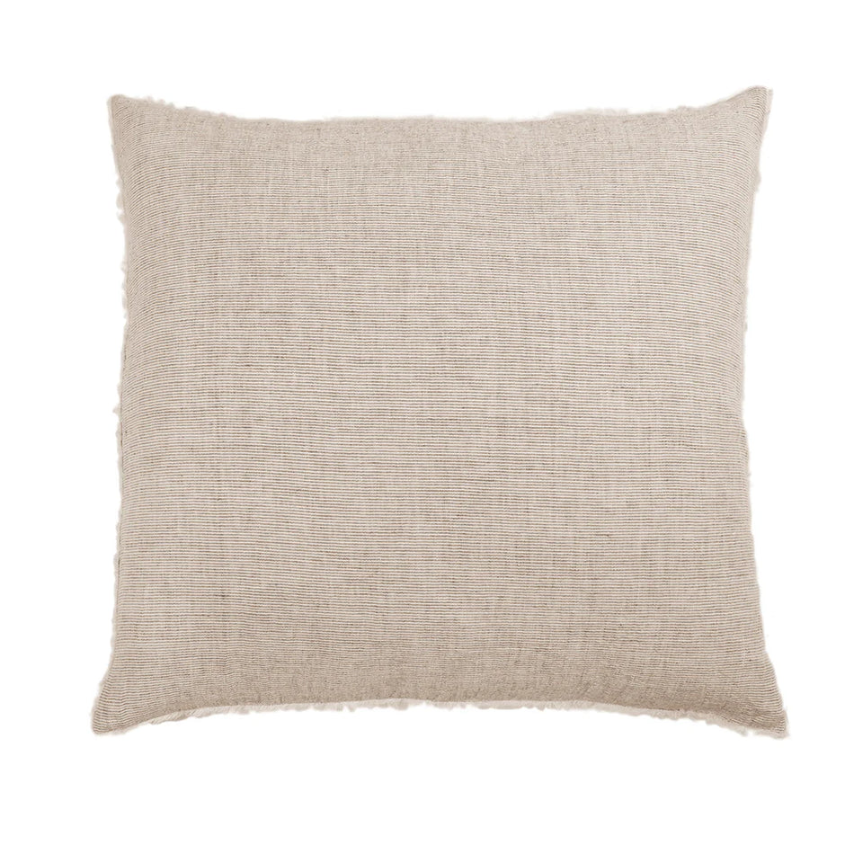 Navy Pom Pom at Home Logan Sham on a bed, features soft fabric with playful pom pom trim, king size decorative pillow sham
