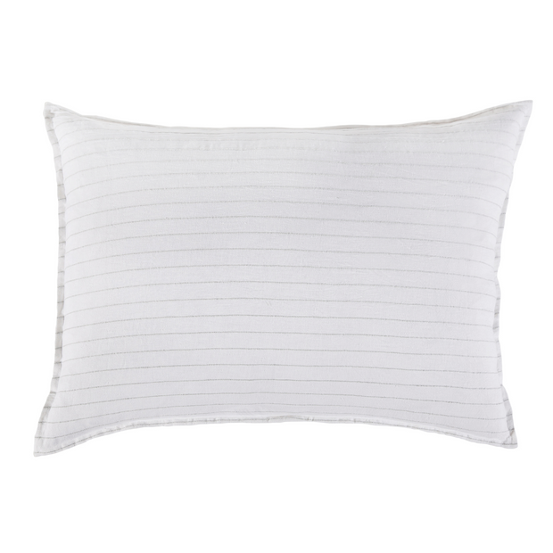 Pom Pom at Home Blake white and ocean-colored standard shams with decorative pom-pom trim on soft fabric.